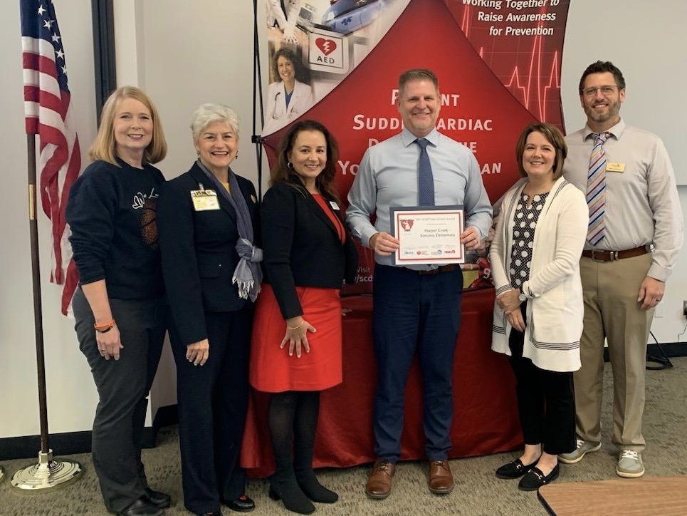 Superintendent Ridgeway accepting Mi HeartSAFE School award